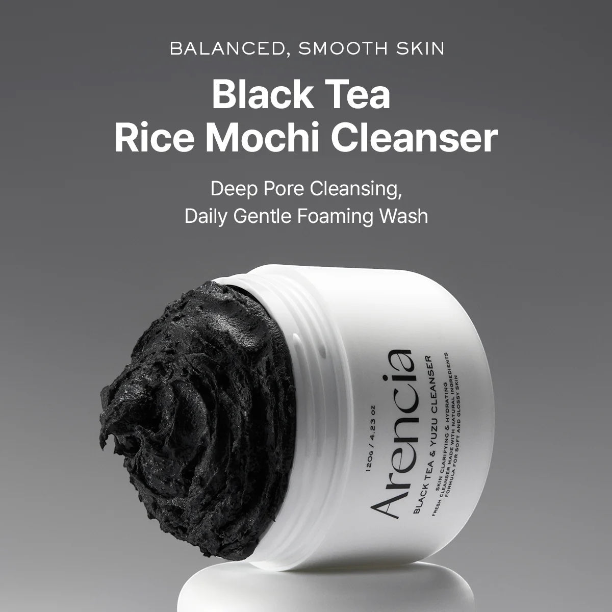 bareskin.lt Arencia Black Tea Rice Mochi Cleanser with a thick, dark, exfoliating texture in a white jar.