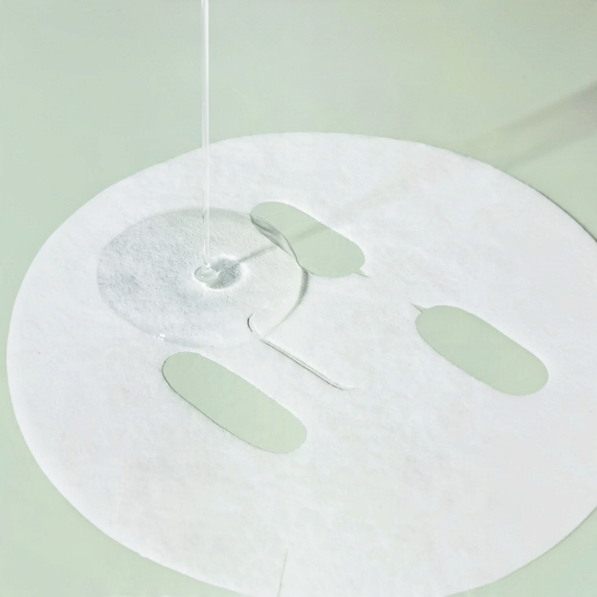 bareskin.lt Beauty of Joseon Calming Barrier sheet mask being infused with hydrating essence on a soft green background