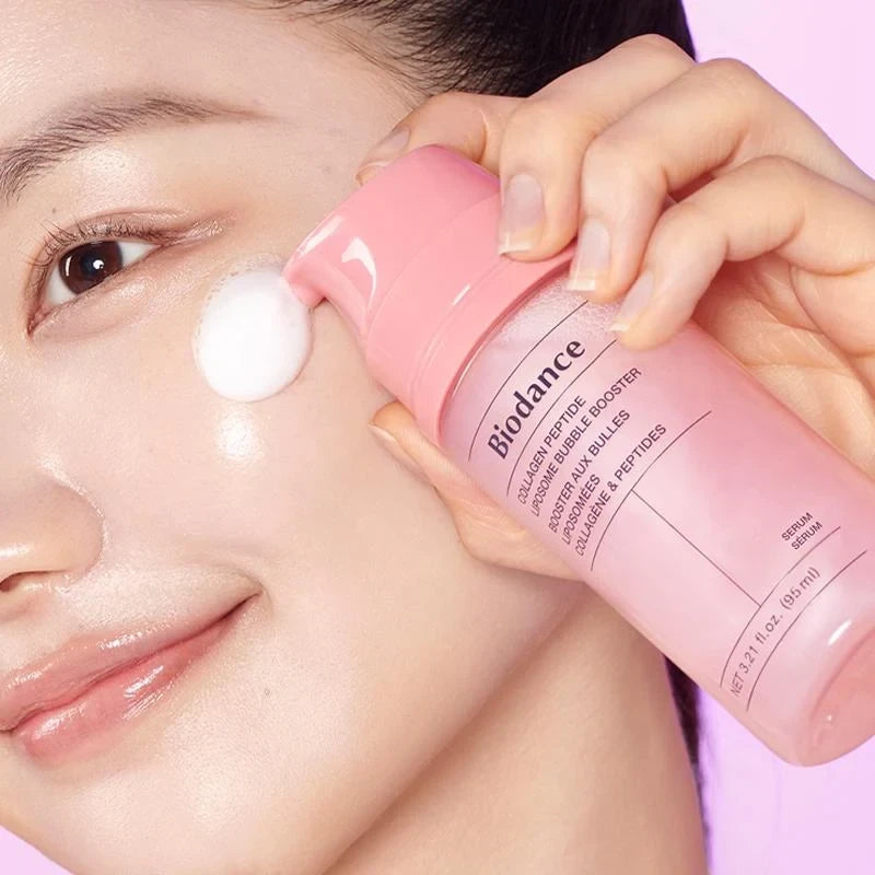 bareskin.lt Biodance Collagen Peptide Liposome Bubble Booster serum being applied to a model's cheek as a white foam
