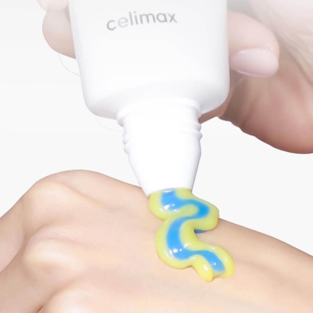 bareskin.lt Celimax dual-formula retinal cream with yellow and blue stripes being dispensed onto a hand