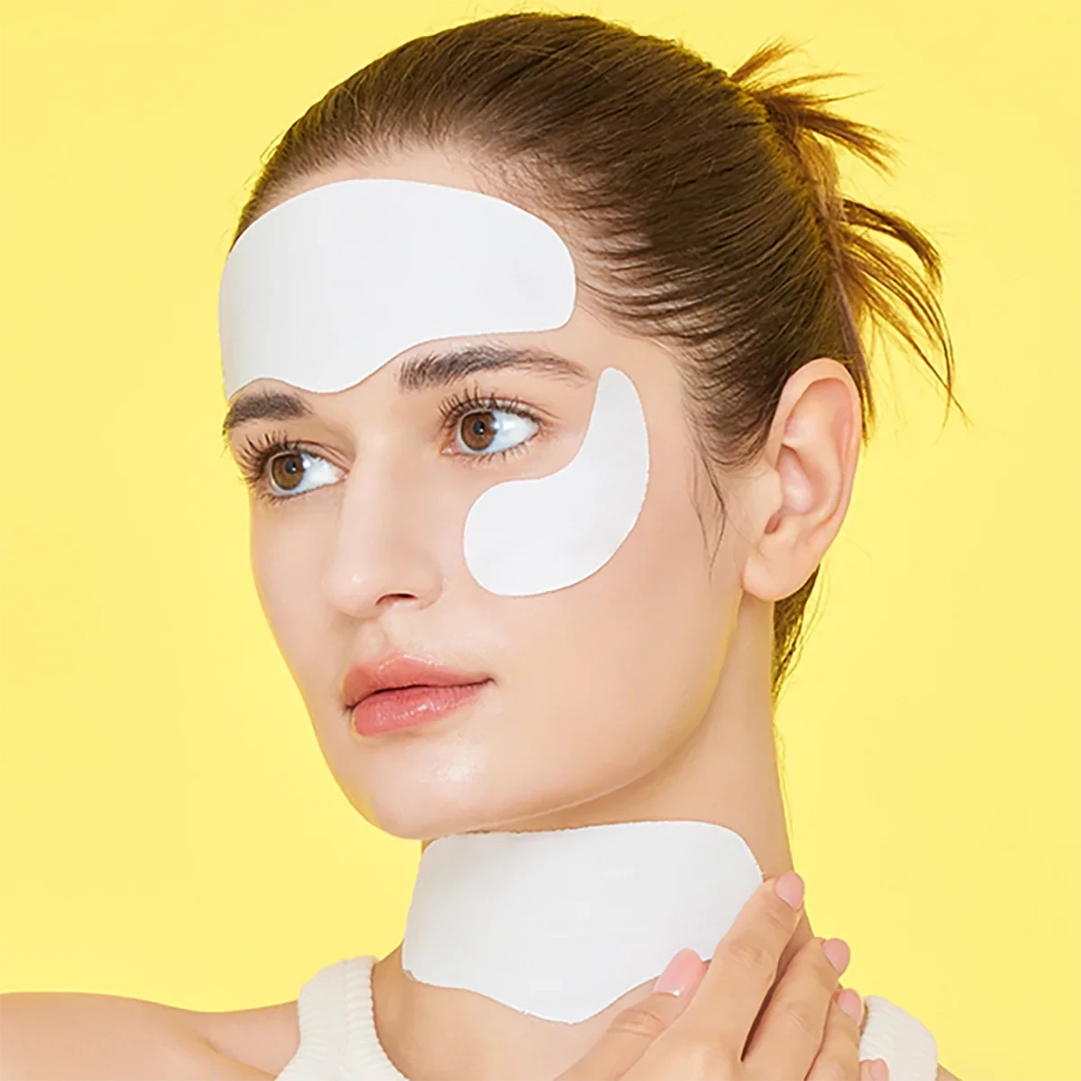Woman applying bareskin.lt Sungboon Editor Deep Collagen Melting Patches on forehead, under eyes, and neck.