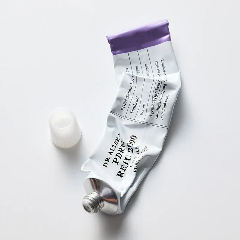 bareskin.lt Dr.Althea PDRN Reju 2000 facial cream in a white and purple squeeze tube with a detached cap