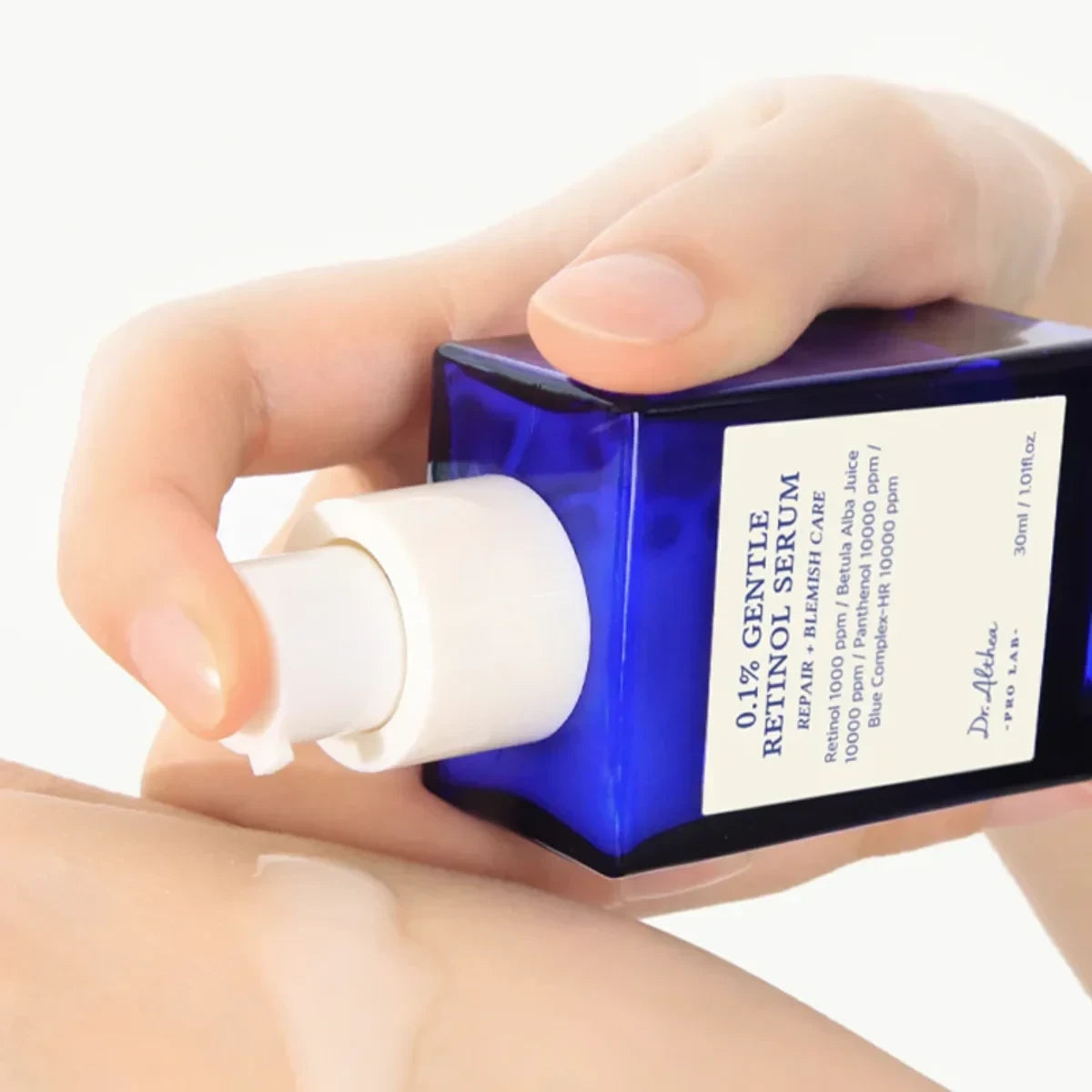 bareskin.lt Dr.Althea 0.1 Gentle Retinol Serum in a blue glass bottle being applied to skin
