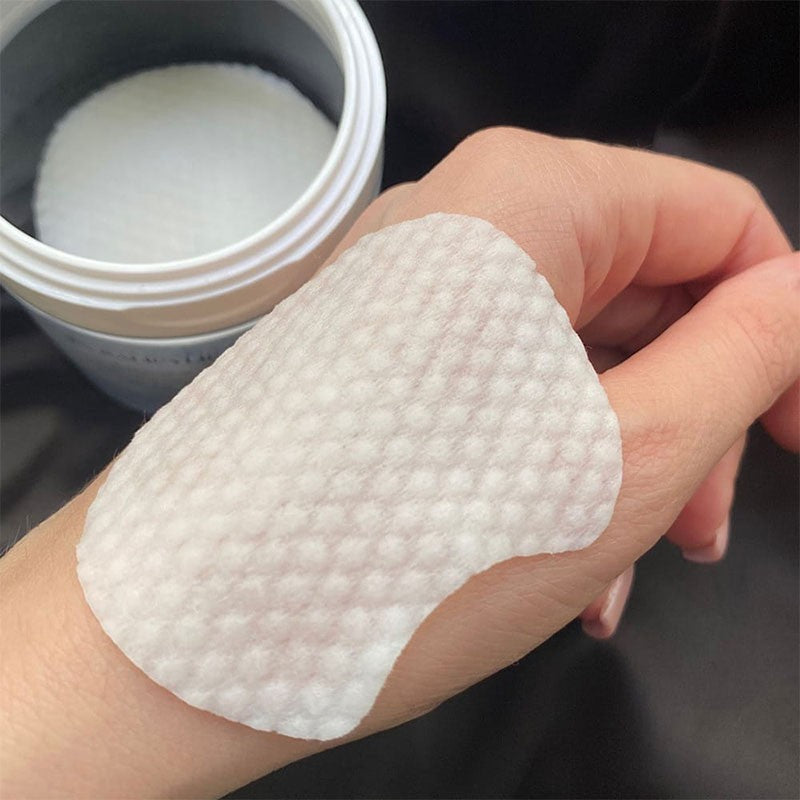 bareskin.lt Dr. Althea 2% Salicylic Acid Clear Pad held on hand showing textured white exfoliating toner pad
