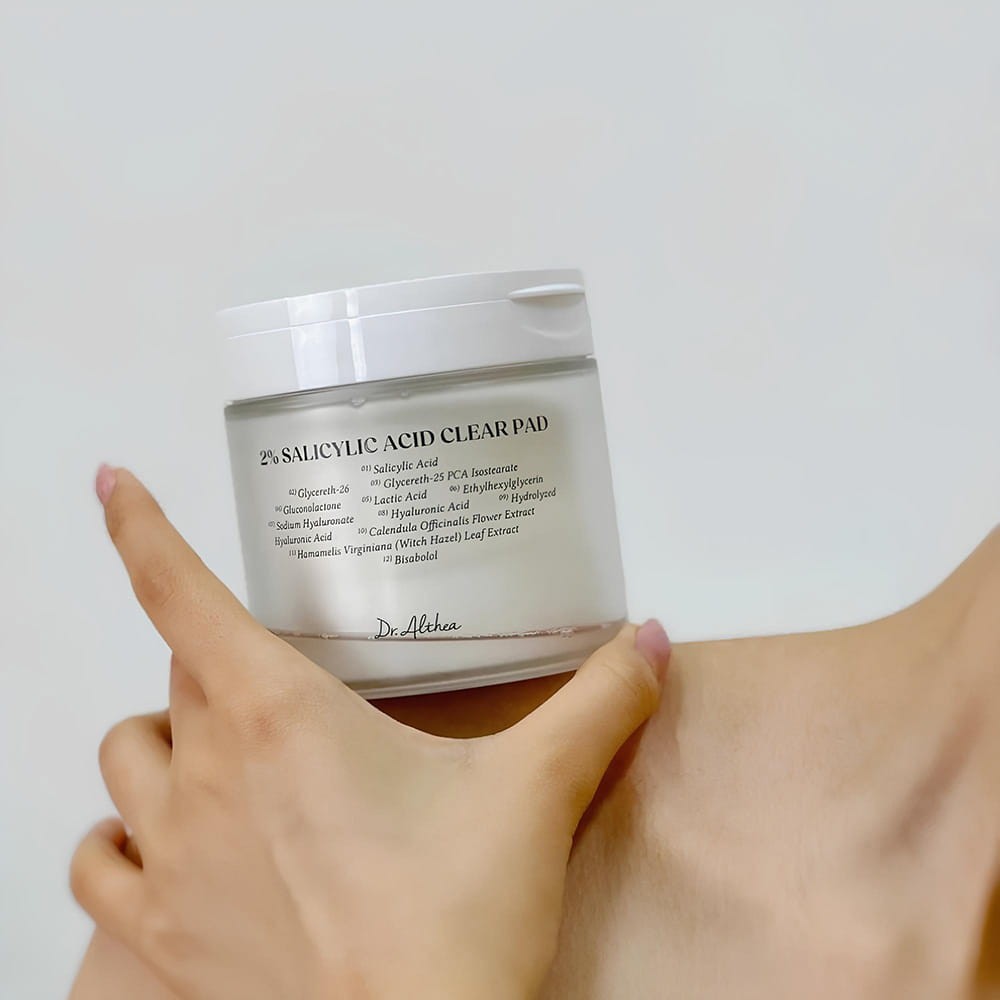 bareskin.lt Dr. Althea 2% Salicylic Acid Clear Pad jar held in hand against a neutral background