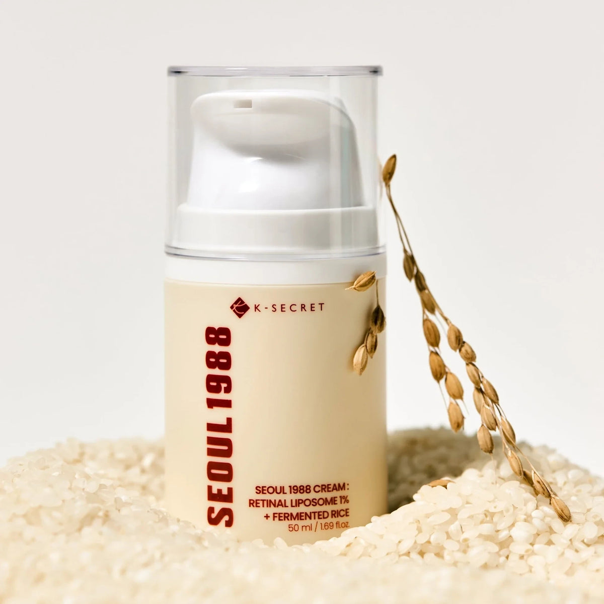 bareskin.lt KSECRET Seoul 1988 face cream with retinal liposome and fermented rice in a pump bottle on rice grains