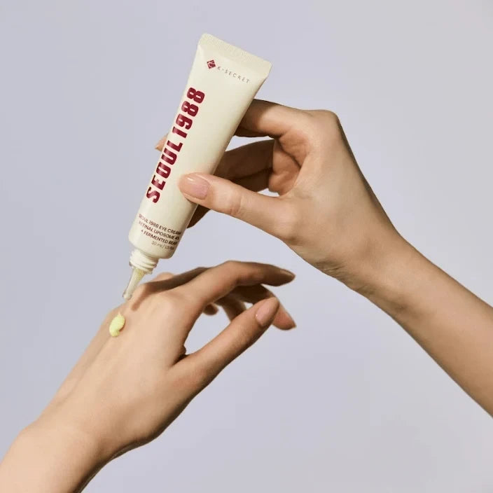 bareskin.lt KSECRET SEOUL 1988 eye cream being applied to hand, showing yellow retinal liposome formula