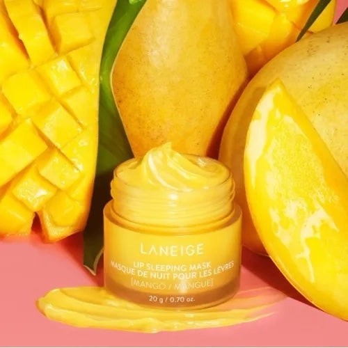 bareskin.lt LANEIGE Mango Lip Sleeping Mask in a yellow jar surrounded by fresh mango slices on a pink background