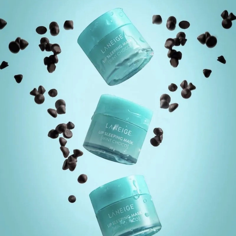 Three LANEIGE Lip Sleeping Mask Mint Choco jars floating with chocolate chips on a light blue background from bareskin.lt