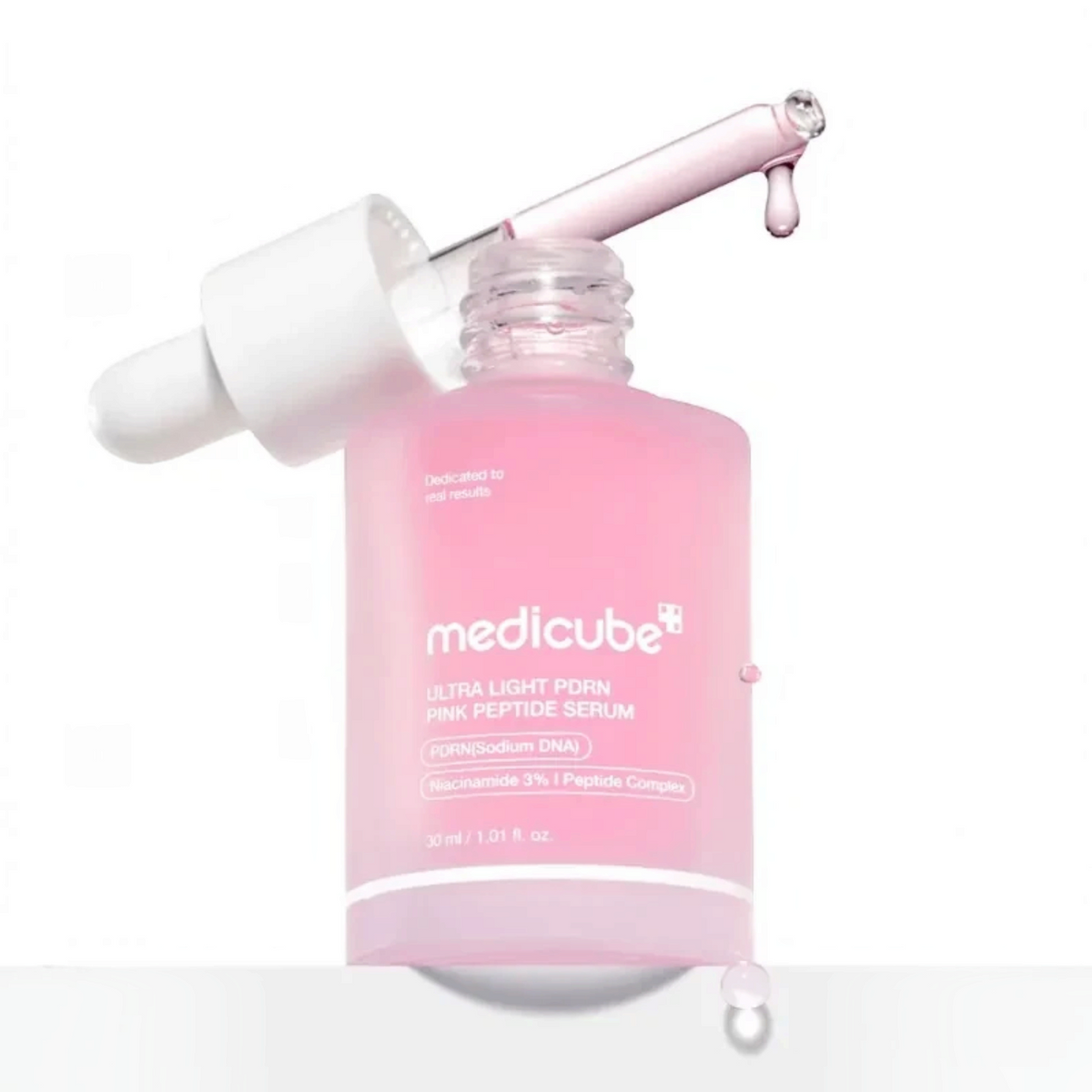 bareskin.lt Medicube Ultra Light PDRN Pink Peptide Serum in a translucent pink glass bottle with a dropper