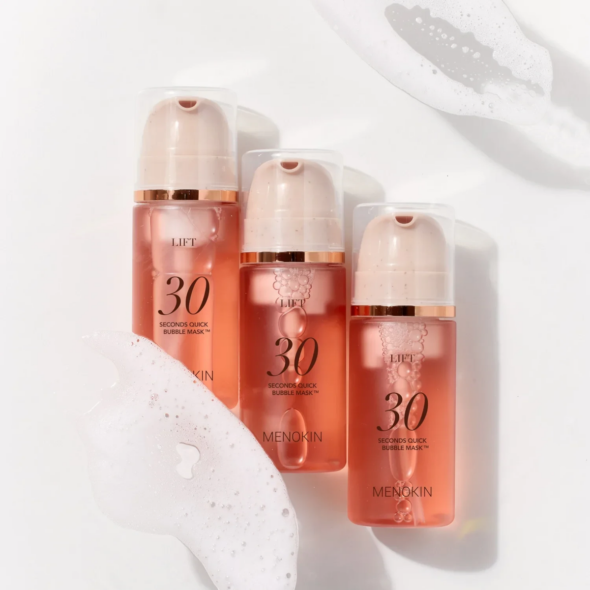 Three bottles of bareskin.lt MENOKIN 30 Seconds Quick Bubble Mask Lift with pink gel and white foam on white background