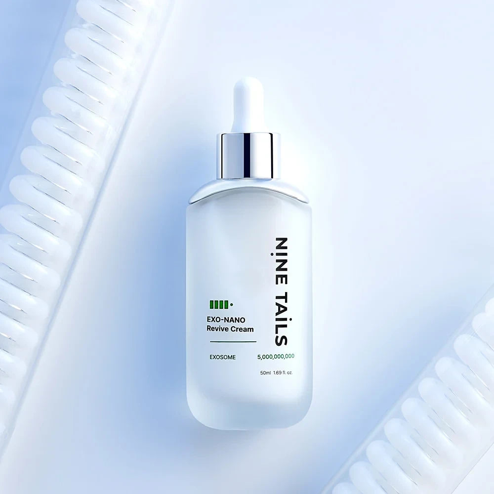 bareskin.lt Nine Tails Exo-Nano Revive Cream in a frosted glass bottle with a white dropper cap on a blue background