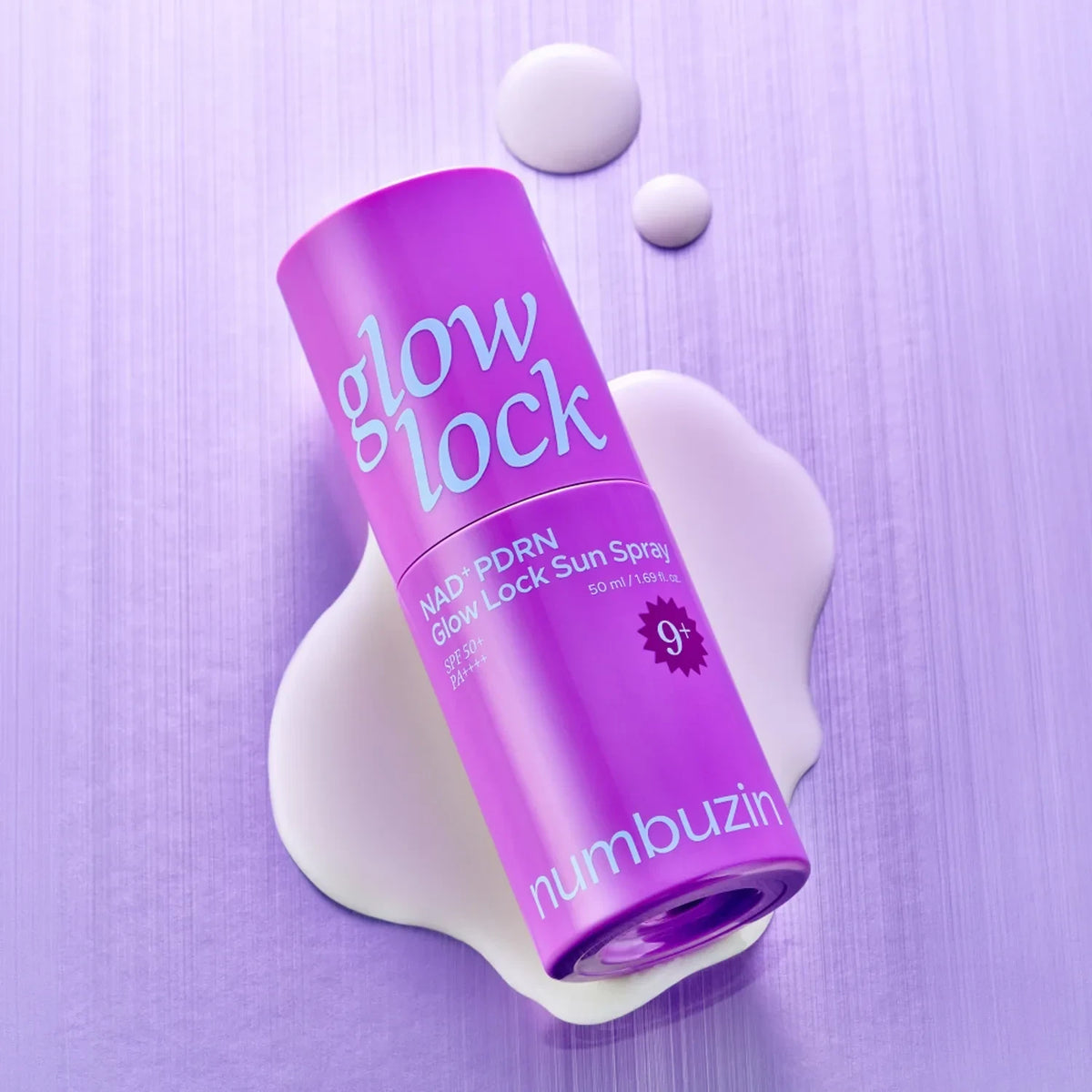 bareskin.lt Numbuzin No.9 NAD+ PDRN Glow Lock Sun Spray in a purple bottle on a matching purple background.