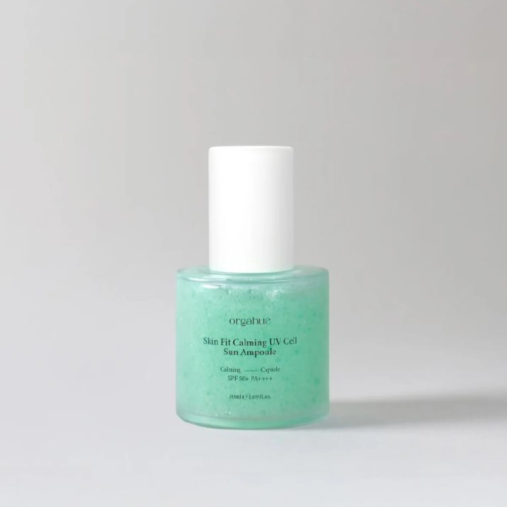 bareskin.lt orgahue Skin Fit Calming UV Cell Sun Ampoule in a clear glass bottle with a light green serum texture.
