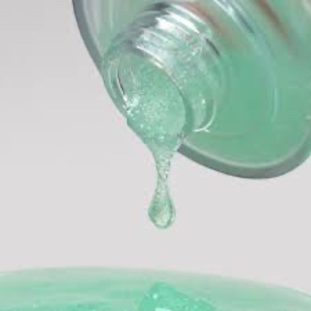bareskin.lt orgahue Skin Fit Calming UV Cell Sun Ampoule with a light green hydrating serum texture dripping