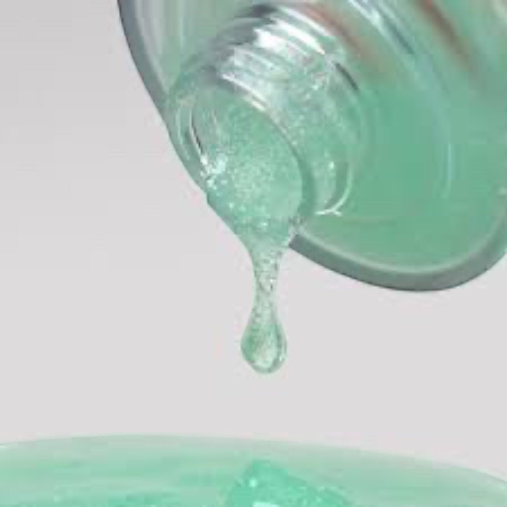 bareskin.lt orgahue Skin Fit Calming UV Cell Sun Ampoule with a light green hydrating serum texture dripping