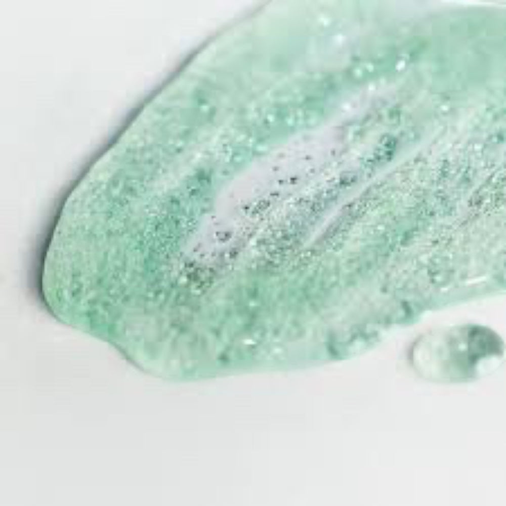 bareskin.lt orgahue Skin Fit Calming UV Cell Sun Ampoule light green serum texture swatch on white background