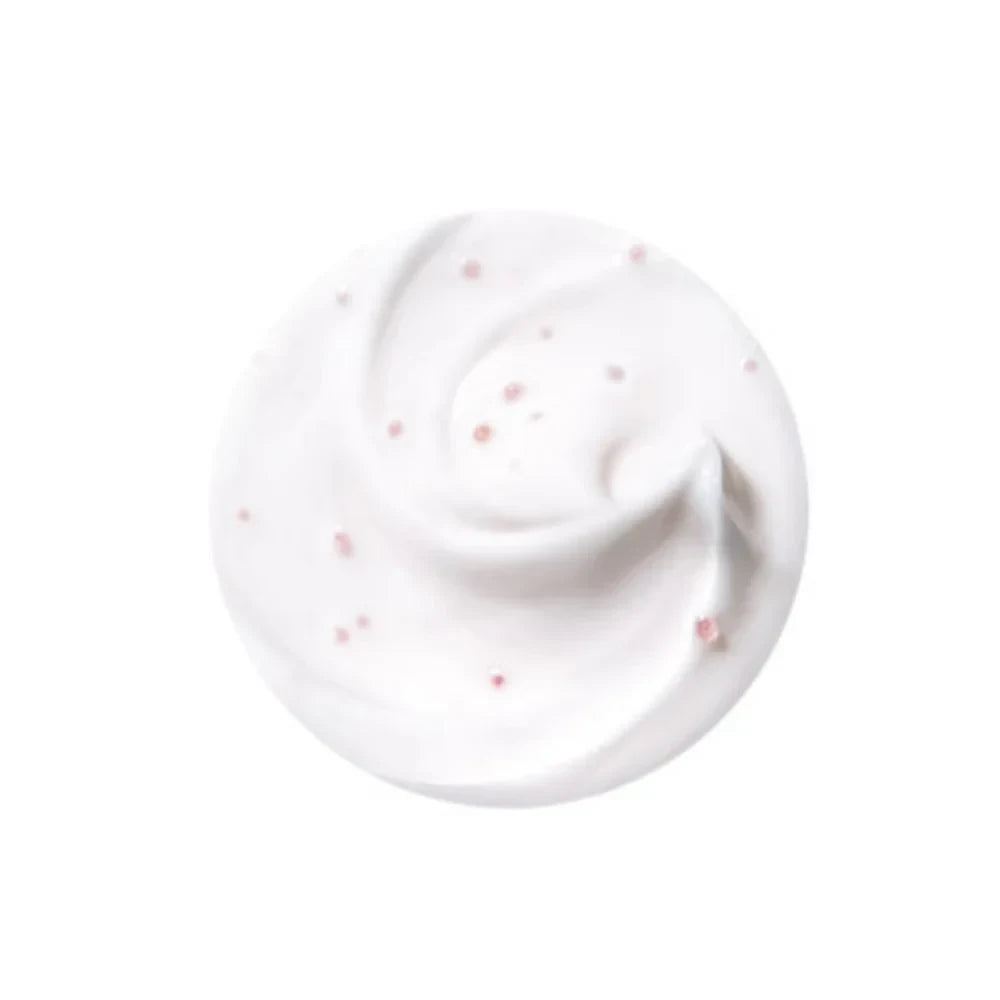 A swirl of white Purito Multi Pdrn Collagen Real Glow Mask cream with small pink beads from bareskin.lt