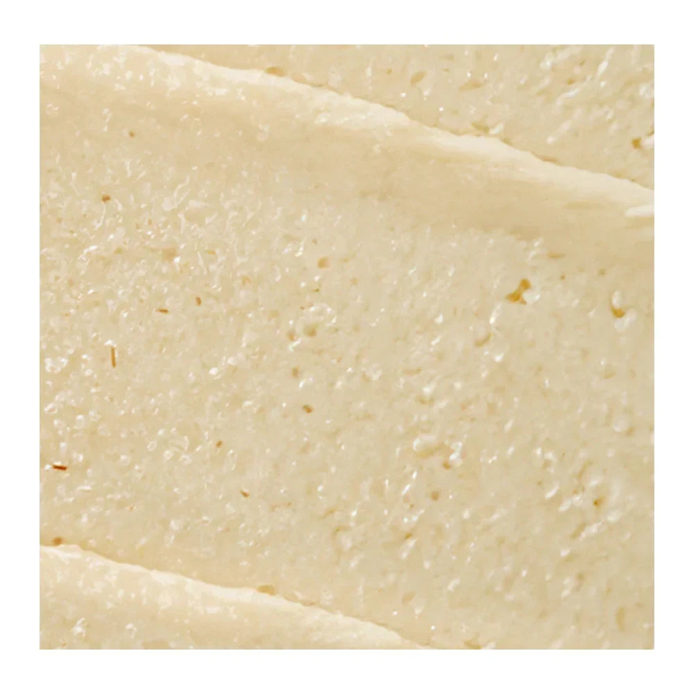 Close-up texture of bareskin.lt Purito SEOUL Oat In Gentle Exfoliating Face Cleanser showing creamy exfoliating scrub