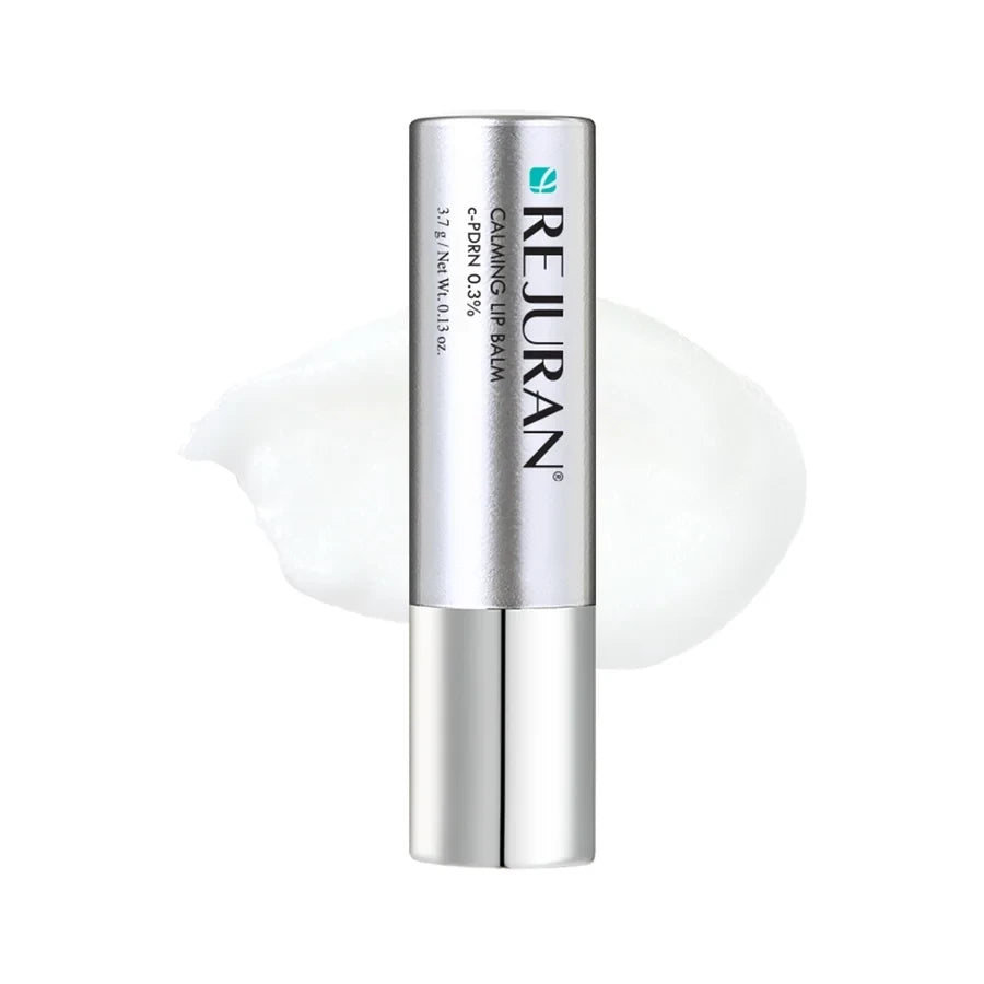 REJURAN Calming Lip Balm from bareskin.lt in a silver tube with a swatch of clear, hydrating lip treatment.