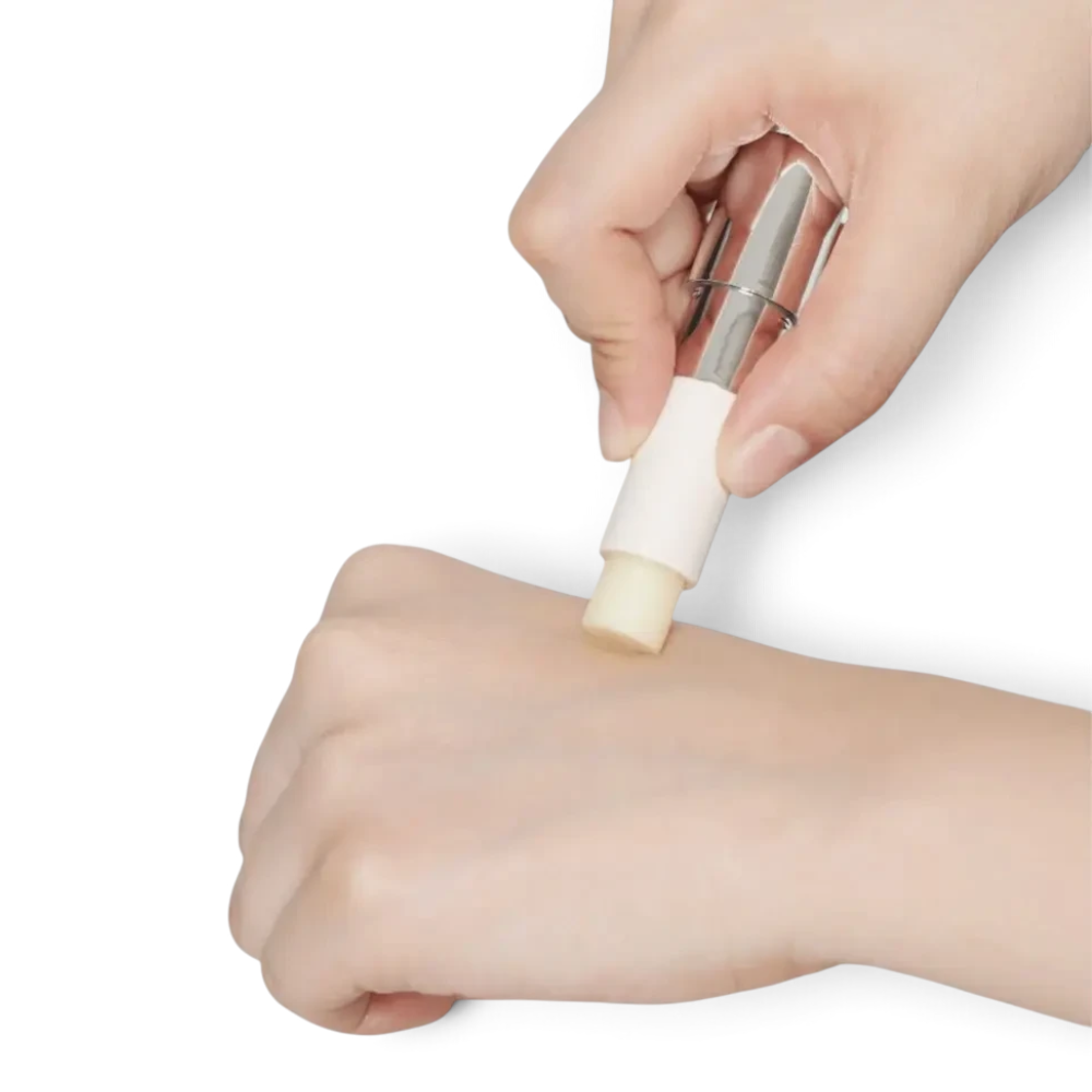 bareskin.lt REJURAN Calming Lip Balm being applied to the back of a hand, showing the smooth, creamy texture.