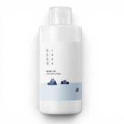 Round Lab 1025 Dokdo Lotion from bareskin.lt in a white bottle with minimalist ocean illustration