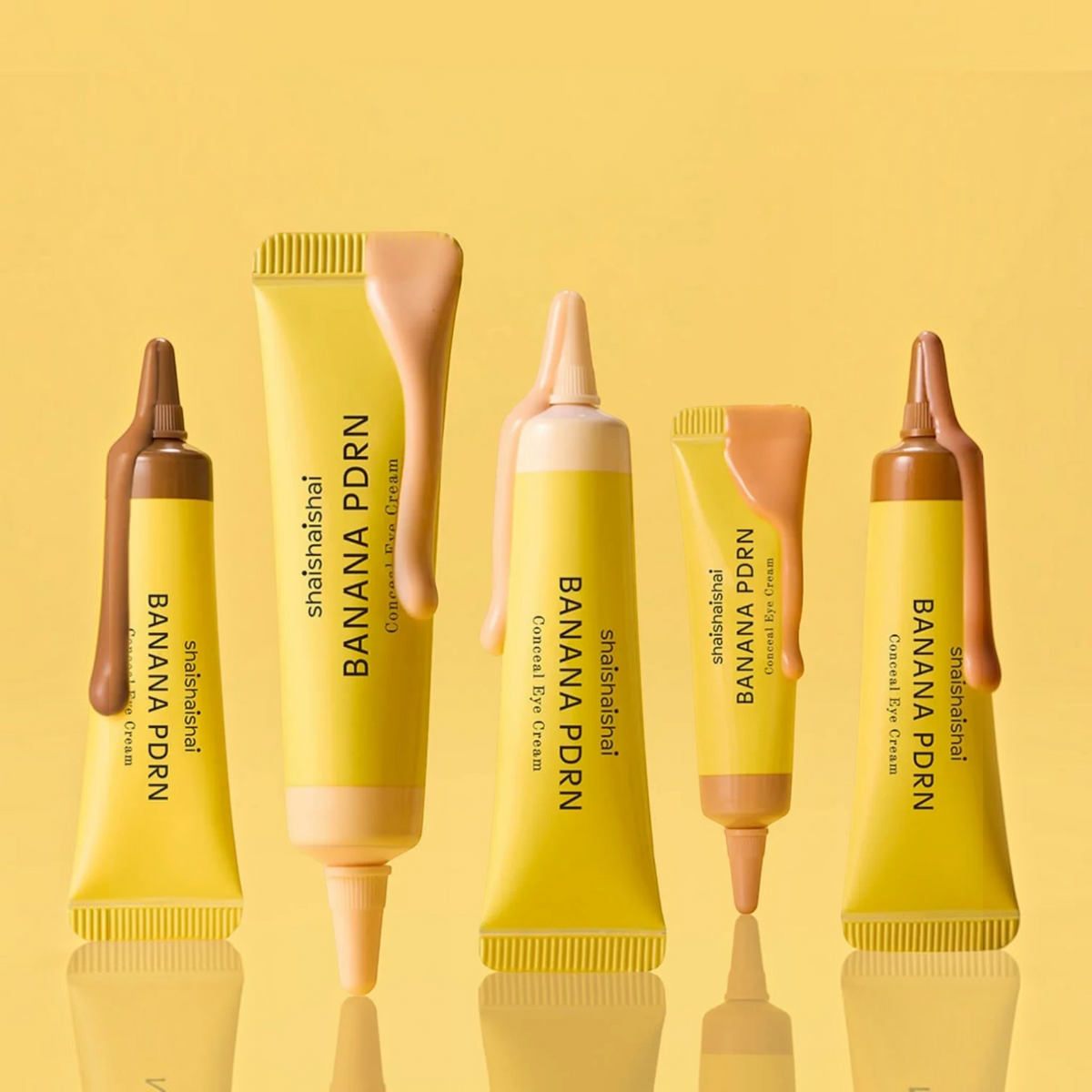 bareskin.lt shaishaishai Banana PDRN Conceal Eye Cream tubes with creamy beige product texture on yellow background