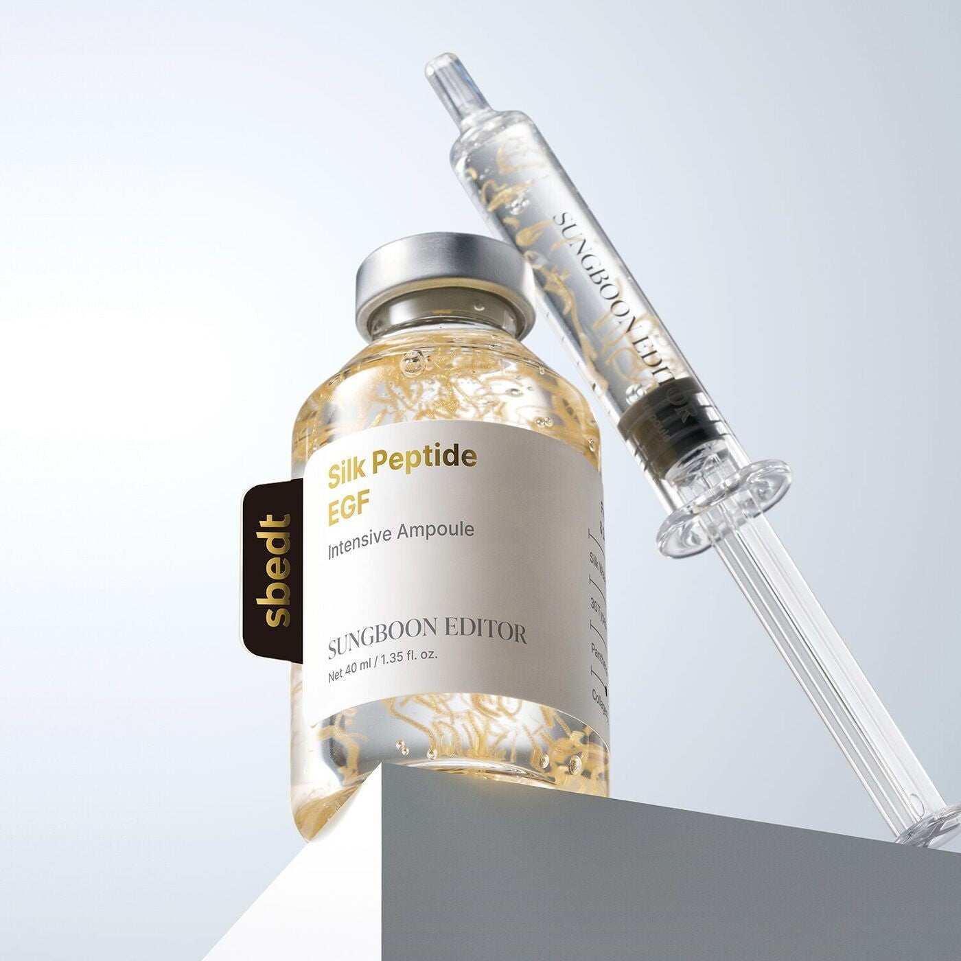 SUNGBOON EDITOR Silk Peptide EGF Intensive Ampoule from bareskin.lt with a clear applicator syringe on a pedestal.