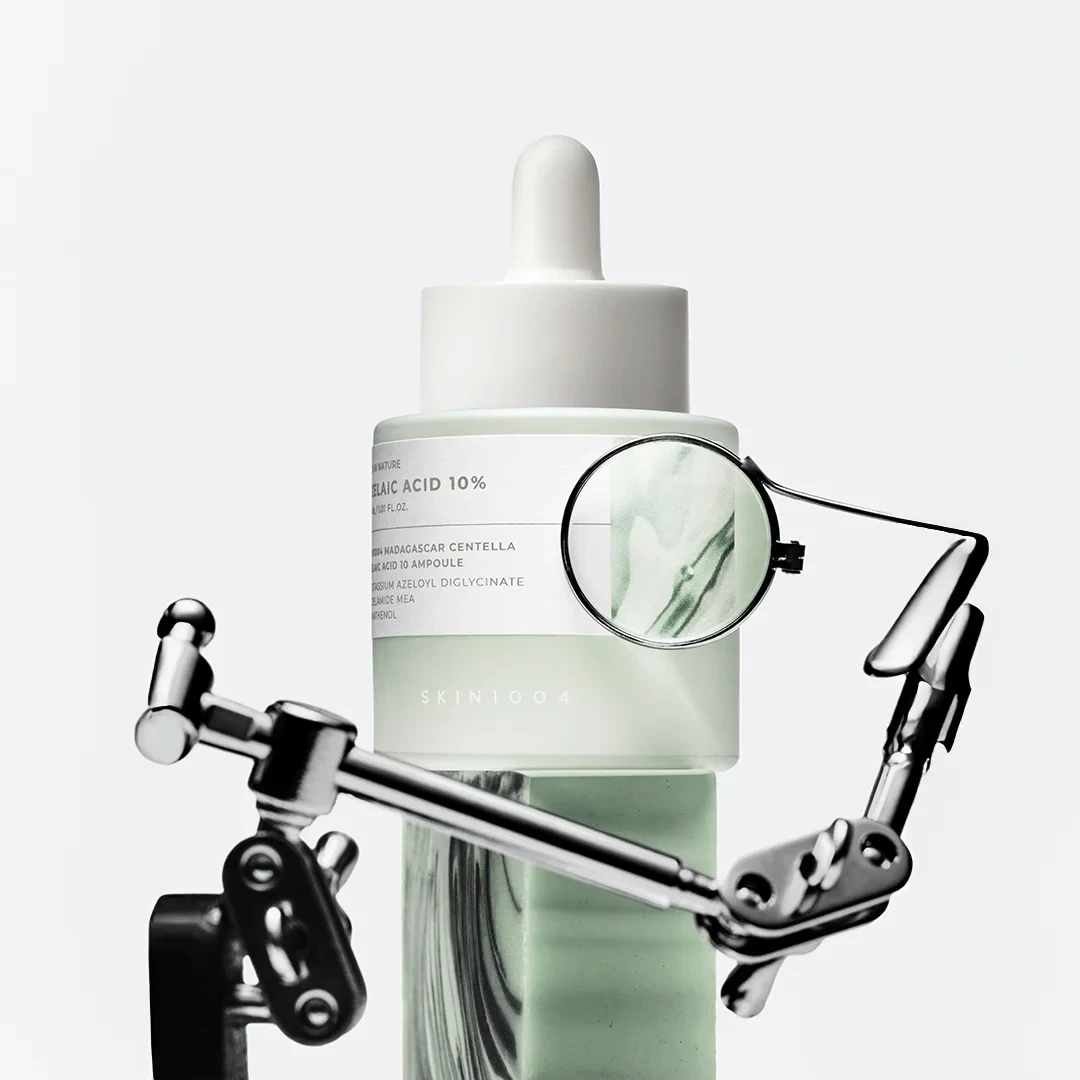 SKIN1004 Madagascar Centella Azelaic Acid 10 Ampoule from bareskin.lt, a pale green serum bottle under a magnifying glass