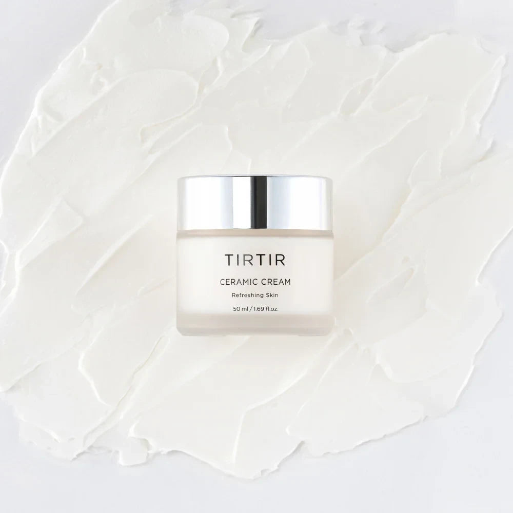 bareskin.lt TIRTIR Ceramic Cream in a glass jar placed on a smooth white cream texture for deep skin hydration