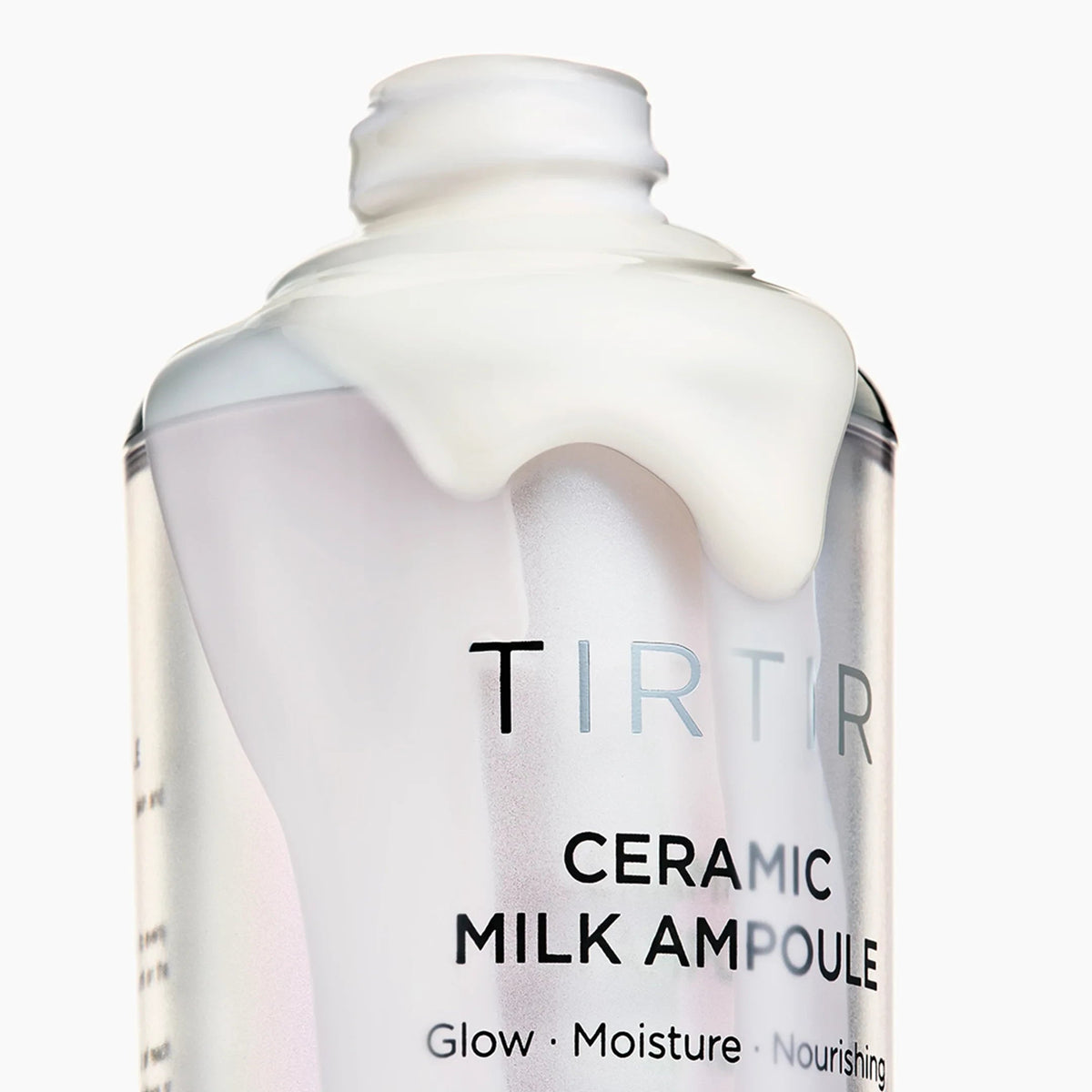 bareskin.lt TIRTIR Ceramic Milk Ampoule with a creamy white texture dripping from the open bottle top