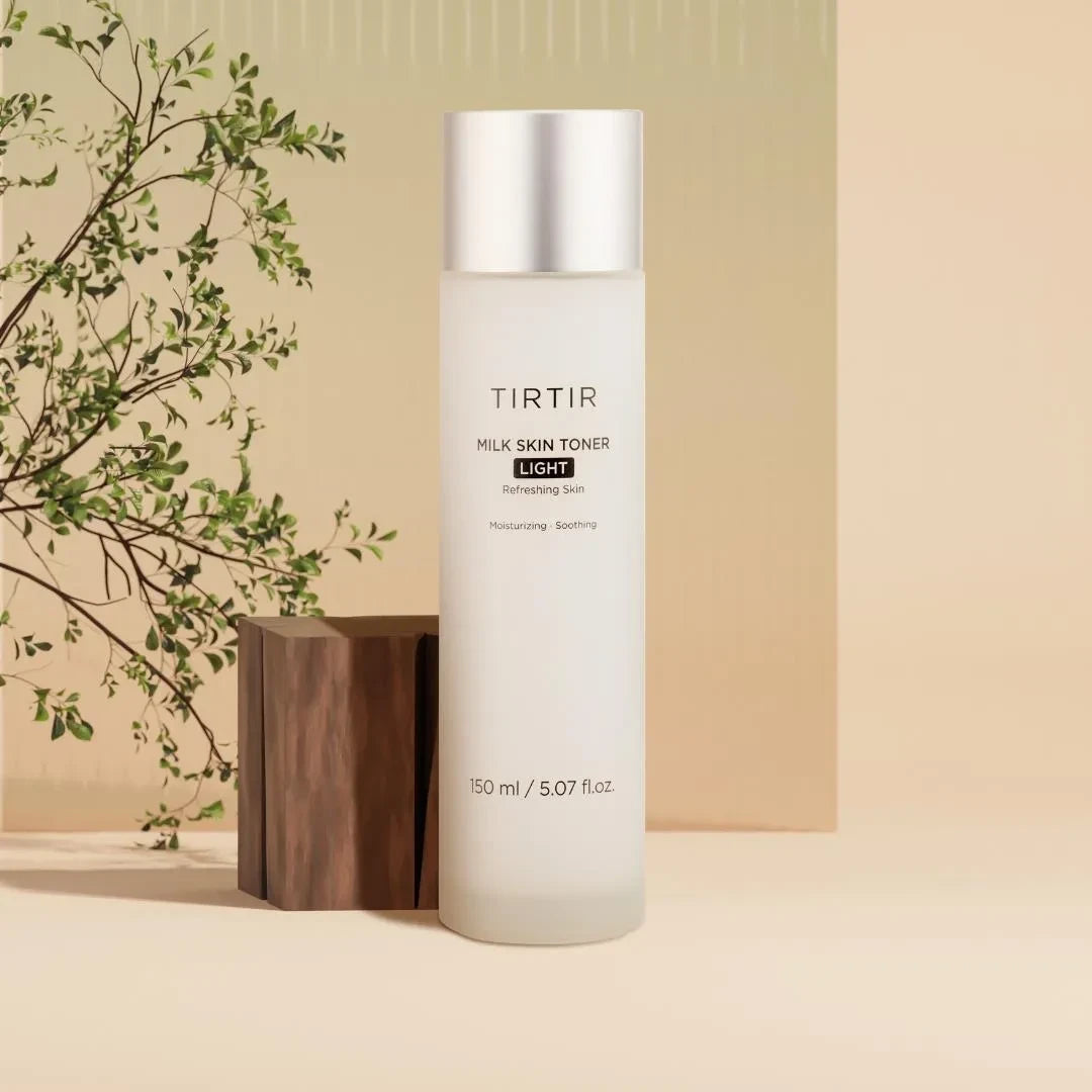 bareskin.lt TIRTIR Milk Skin Toner Light in a frosted bottle with a silver cap, set against a minimalist background.