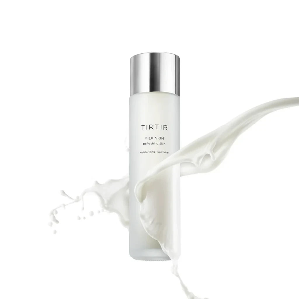 bareskin.lt TIRTIR Milk Skin Toner in a clear bottle with a silver cap, surrounded by a milky liquid splash effect.