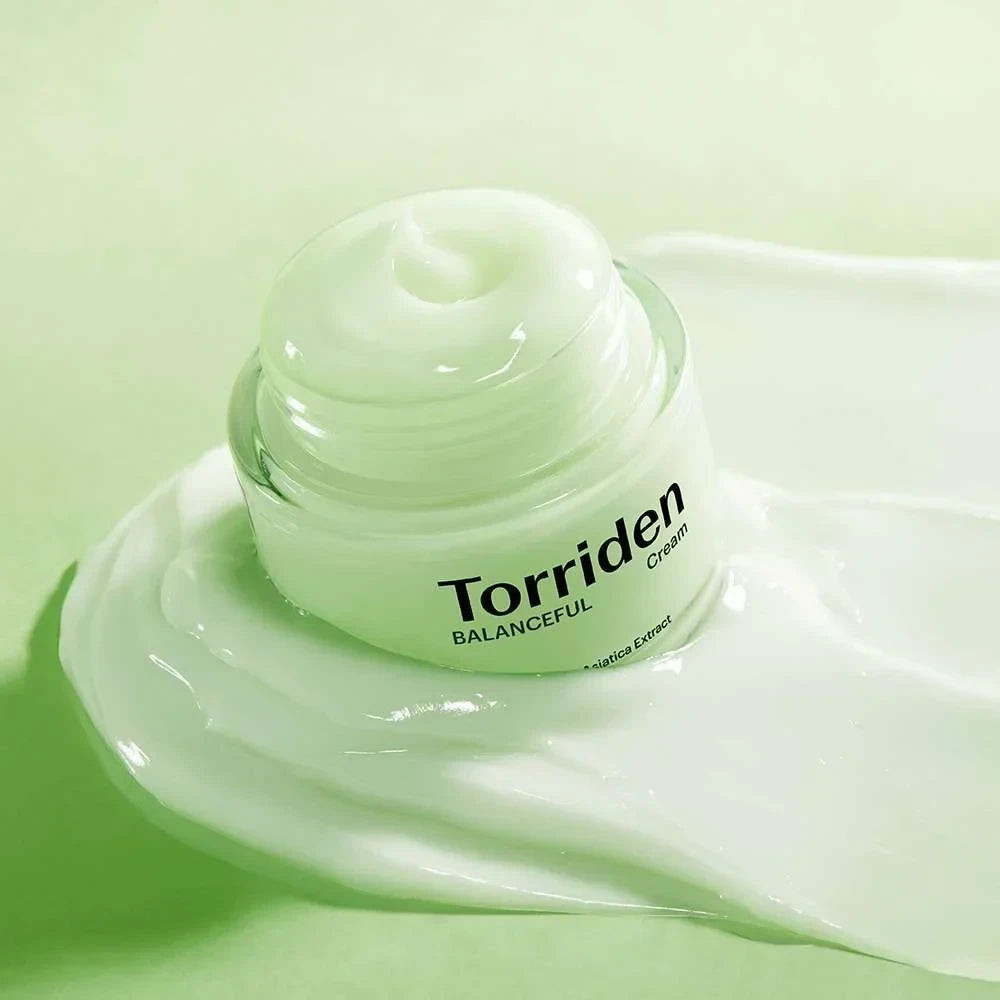 bareskin.lt Torriden Balanceful Cica Cream in a glass jar with a smooth, light green textured cream smear