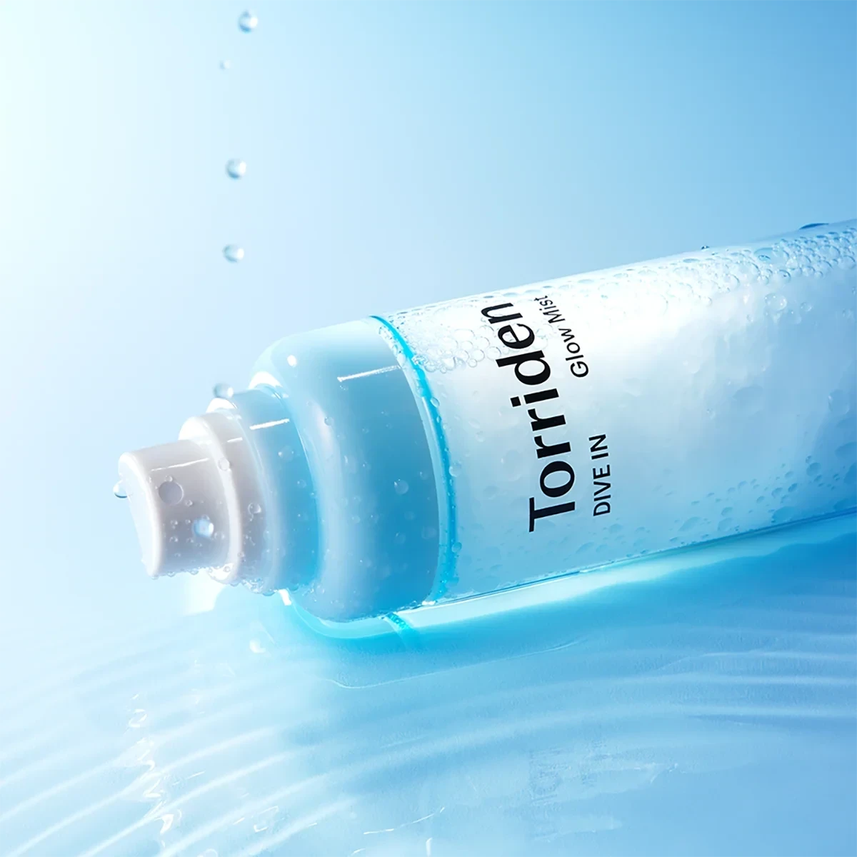 bareskin.lt Torriden Dive In Glow Mist facial spray bottle with water droplets on a blue background