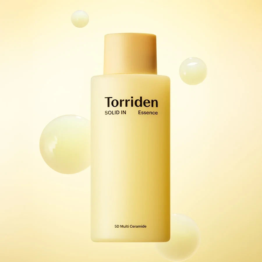 bareskin.lt Torriden Solid-In All Day Essence bottle with floating serum droplets on a soft yellow background