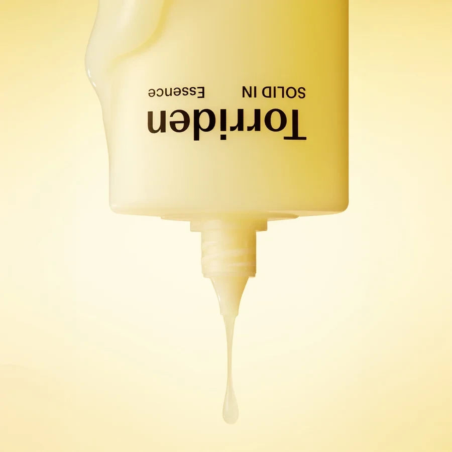 bareskin.lt Torriden Solid-In All Day Essence with ceramides and panthenol, featuring a milky, lightweight texture.