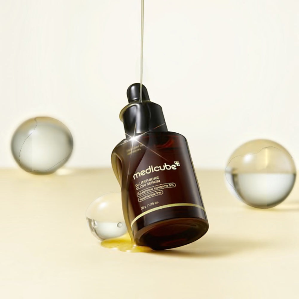 Medicube Glutathione Glow Serum by bareskin.lt in a dark glass bottle with a dropper, featuring a glowing texture.