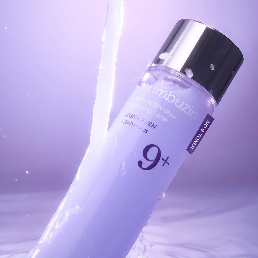 Numbuzin No.9 NAD PDRN Glow Boosting Toner from bareskin.lt in a purple bottle with water splash effect.