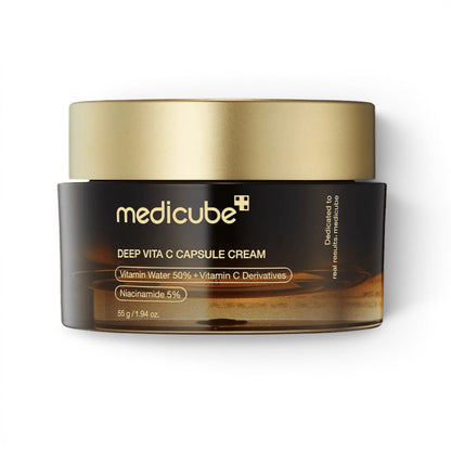 Medicube Deep Vita C Capsule Cream from bareskin.lt in a brown glass jar with a gold lid for brightening skin.